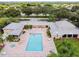 Aerial view of the community pool and surrounding recreation area at 3790 Pinebrook Cir # 103, Bradenton, FL 34209
