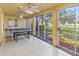 Inviting recreation room with a ping pong table and views of the lush outdoor surroundings at 3790 Pinebrook Cir # 103, Bradenton, FL 34209