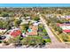 Aerial shot of a home near the ocean with lush landscaping and mature trees at 400 Nokomis S Ave, Venice, FL 34285