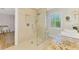 Stylish bathroom showcasing granite countertop vanity, glass shower, and neutral tiling at 400 Nokomis S Ave, Venice, FL 34285
