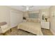 Bedroom with large closet, ceiling fan, and a neutral color scheme at 400 Nokomis S Ave, Venice, FL 34285