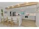 Bright, modern kitchen with stainless appliances, a large island, and a light, airy aesthetic at 400 Nokomis S Ave, Venice, FL 34285