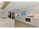 Bright, modern kitchen with stainless appliances and white countertops at 400 Nokomis S Ave, Venice, FL 34285