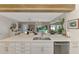 Bright, open kitchen with stainless appliances, a large island, and dining area at 400 Nokomis S Ave, Venice, FL 34285