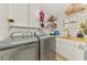 Efficient laundry room with modern appliances, ample counter space, and storage options at 400 Nokomis S Ave, Venice, FL 34285