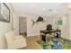 Bright home office featuring a desk, chair, and fish art, offering a functional and stylish workspace at 400 Nokomis S Ave, Venice, FL 34285