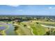 Gorgeous aerial view of a sprawling golf course community and the clubhouse at 4002 Las Palmas Way, Sarasota, FL 34238