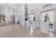 Bright and airy foyer with soaring ceilings and elegant display nooks with luxury finishes at 4002 Las Palmas Way, Sarasota, FL 34238