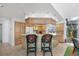 Spacious kitchen with an island, bar seating, and ample cabinet space, great for cooking and entertaining guests at 4002 Las Palmas Way, Sarasota, FL 34238