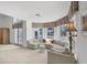 Bright living room with a large window, vaulted ceiling, and a comfortable sectional sofa at 4002 Las Palmas Way, Sarasota, FL 34238