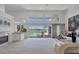 Spacious living room with access to the pool and golf course views through large windows at 4002 Las Palmas Way, Sarasota, FL 34238
