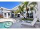 Pool and backyard patio with palms, furniture, and stunning views of the surrounding landscape at 4002 Las Palmas Way, Sarasota, FL 34238