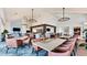 Spacious restaurant featuring modern chandeliers, neutral decor, and comfortable seating arrangements for dining at 4002 Las Palmas Way, Sarasota, FL 34238