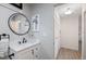 Bathroom with a modern vanity, elegant mirror, and contemporary fixtures at 4009 Crockers Lake Blvd # 25, Sarasota, FL 34238