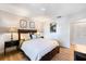 Cozy bedroom featuring wood floors, a ceiling fan, and decorative wall art, creating a welcoming space at 4009 Crockers Lake Blvd # 25, Sarasota, FL 34238