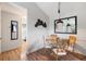 Charming dining area with hardwood floors, a glass table setting for four, and stylish decor at 4009 Crockers Lake Blvd # 25, Sarasota, FL 34238