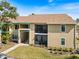 Two-story apartment building with private balconies and manicured landscaping at 4009 Crockers Lake Blvd # 25, Sarasota, FL 34238