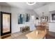 Open-concept living area with modern furnishings, artful decorations, and seamless flow to the dining space at 4009 Crockers Lake Blvd # 25, Sarasota, FL 34238