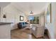 Bright living room with stylish furniture, modern decor, and large windows with verdant views at 4009 Crockers Lake Blvd # 25, Sarasota, FL 34238