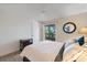 Bright bedroom with a view of the balcony and outdoor scenery at 4009 Crockers Lake Blvd # 25, Sarasota, FL 34238
