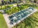 Overhead view of a shuffleboard court, surrounded by lush greenery and providing a relaxing recreation area at 4009 Crockers Lake Blvd # 25, Sarasota, FL 34238