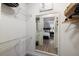 Spacious walk-in closet with shelving and a glimpse of a well-lit bedroom with a plush bed at 4009 Crockers Lake Blvd # 25, Sarasota, FL 34238