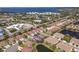 Scenic aerial capture of a neighborhood with charming homes and picturesque lakes, close to local beaches at 4015 Bridlecrest Ln, Bradenton, FL 34209