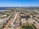 Breathtaking aerial perspective of a residential area highlighting beautiful homes and adjacent community lakes at 4015 Bridlecrest Ln, Bradenton, FL 34209