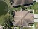 Expansive aerial view of the property featuring a tranquil lake and lush landscaping within a well-planned community at 4015 Bridlecrest Ln, Bradenton, FL 34209