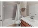 A clean bathroom featuring tiled shower/tub, vanity sink, and a mirrored wall at 4015 Bridlecrest Ln, Bradenton, FL 34209