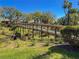 Scenic wooden bridge overlooking a lush creek, enhancing the community's natural beauty at 4015 Bridlecrest Ln, Bradenton, FL 34209