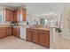 Eat-in kitchen featuring white appliances, wood cabinets, and spacious counter tops at 4015 Bridlecrest Ln, Bradenton, FL 34209