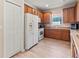 A well-lit kitchen includes stainless appliances, and abundant wood cabinets at 4015 Bridlecrest Ln, Bradenton, FL 34209