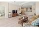 Cozy living room overlooking the breakfast bar and featuring an entertainment center with large television at 4015 Bridlecrest Ln, Bradenton, FL 34209