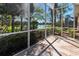 Enjoy picturesque water views from this screened lanai, perfect for relaxing and entertaining, with privacy landscaping at 4015 Bridlecrest Ln, Bradenton, FL 34209