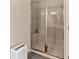 Spacious bathroom with glass shower featuring tile surround and a built-in bench at 4015 Bridlecrest Ln, Bradenton, FL 34209