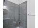 Bathroom featuring a modern shower with gray tile surround and glass door at 4629 Antrim Dr, Sarasota, FL 34240