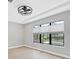Serene bedroom featuring recessed lighting, a ceiling fan, and a large window with a view of the pool at 4629 Antrim Dr, Sarasota, FL 34240