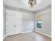 Bedroom featuring hardwood floors, a window and a closet at 4629 Antrim Dr, Sarasota, FL 34240