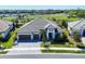 A luxurious two-story home featuring a beautifully paved driveway and a spacious three-car garage at 4629 Antrim Dr, Sarasota, FL 34240
