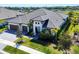 An attractive two-story house with well-kept landscaping and a three-car garage in a sunny setting at 4629 Antrim Dr, Sarasota, FL 34240