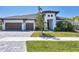 Charming single-Gathering home boasts a three-car garage, manicured lawn, and a welcoming facade at 4629 Antrim Dr, Sarasota, FL 34240