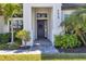 The home's entrance features a classic dark-colored door, highlighted by well-maintained landscaping and architectural features at 4629 Antrim Dr, Sarasota, FL 34240