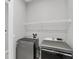 Laundry room featuring new gray washer and dryer at 4629 Antrim Dr, Sarasota, FL 34240