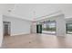 This spacious living room boasts light wood floors, sliders to the lanai, and recessed lighting at 4629 Antrim Dr, Sarasota, FL 34240