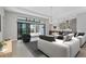 Open living room with modern furnishings, large windows, and seamless flow to the kitchen and outdoor area at 4629 Antrim Dr, Sarasota, FL 34240