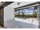 A covered patio with brick floors and a screened pool at 4629 Antrim Dr, Sarasota, FL 34240