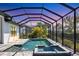 Beautiful screened pool with a built-in spa and ample patio space perfect for relaxation and outdoor enjoyment at 4629 Antrim Dr, Sarasota, FL 34240