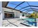 Backyard pool area with a connected spa and tiled patio, perfect for relaxing and entertaining in a private outdoor setting at 4629 Antrim Dr, Sarasota, FL 34240