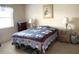 Comfortable bedroom with two side tables, lamps, nautical themed decor and a full size bed at 4933 Village Gardens Dr # 211, Sarasota, FL 34234